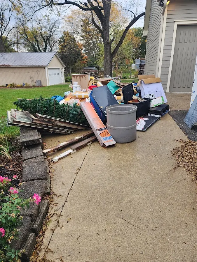 Dumpster being loaded with debris for Demolition Dumpster Rental in Millersville